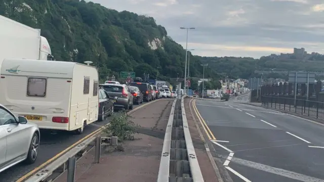 A large queue of cars wait to approach the Port of Dover