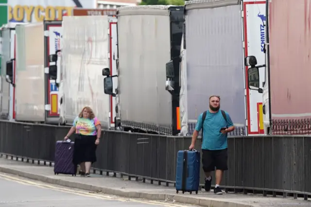 Travellers wheel their suitcases to the Port of Dover