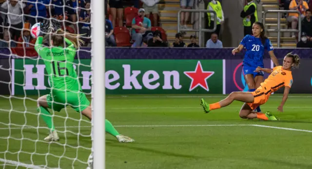 Daphne van Domselaar of Netherlands saves a shot from Delphine Cascarino of France (2nd right) during the UEFA Women's Euro England 2022 Quarter Final match between France and Netherlands at The New York Stadium on July 23, 2022 in Rotherham, United Kingdom.