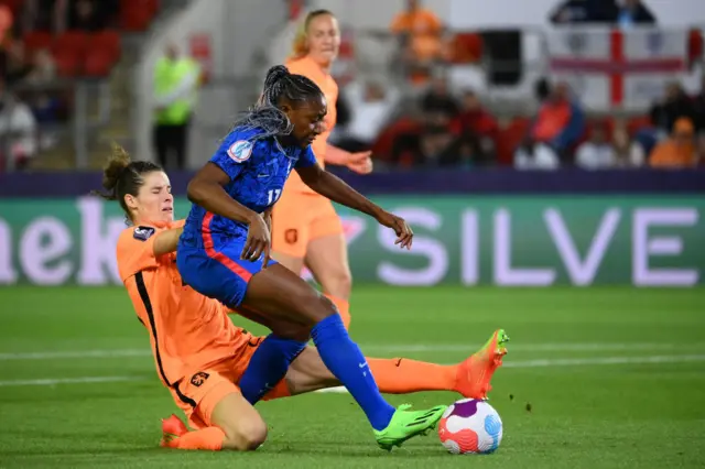 Dominique Janssen (L) fouls France's striker Kadidiatou Diani during the UEFA Women's Euro 2022 quarter final football match between France and Netherlands at the New York Stadium, in Rotherham, on July 23, 2022.