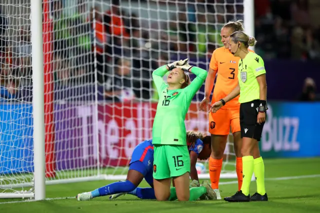 Daphne van Domselaar of The Netherlands reacts after clashing with Grace Geyoro of France during the UEFA Women's Euro 2022 Quarter Final match between France and Netherlands at The New York Stadium on July 23, 2022 in Rotherham, England