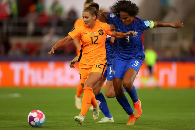 Victoria Pelova of The Netherlands is challenged by Wendie Renard of France during the UEFA Women's Euro 2022 Quarter Final match between France and Netherlands at The New York Stadium on July 23, 2022 in Rotherham, England.