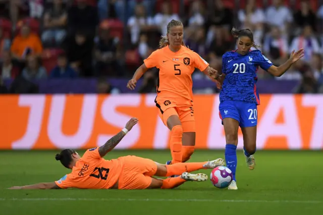 Delphine Cascarino of France is challenged by Sherida Spitse and Lynn Wilms of The Netherlands during the UEFA Women's Euro 2022 Quarter Final match between France and Netherlands at The New York Stadium on July 23, 2022