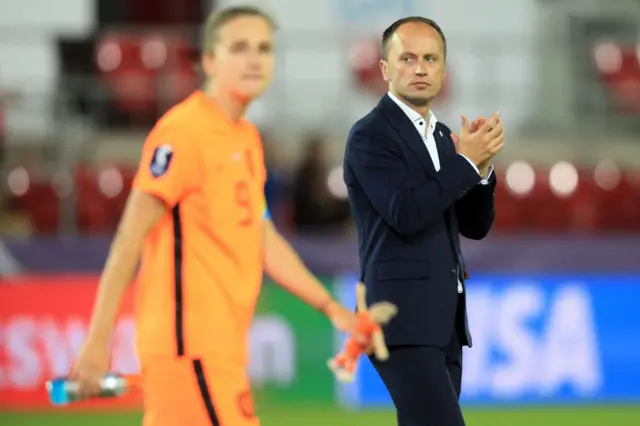 Netherlands' head coach Mark Parsons applauds at the end of the UEFA Women's Euro 2022 quarter final football match between France and Netherlands at the New York Stadium, in Rotherham, on July 23, 2022.