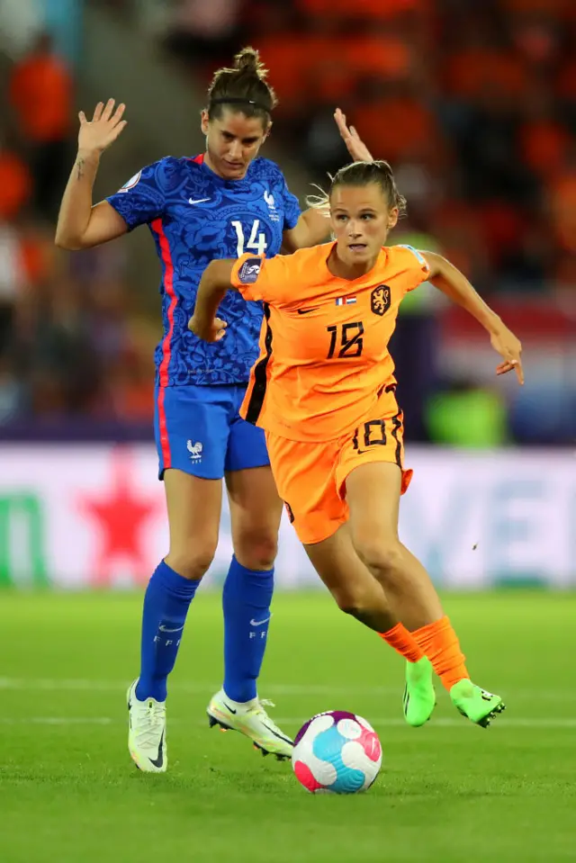 Kerstin Casparij of The Netherlands is challenged by Charlotte Bilbault of France during the UEFA Women's Euro 2022 Quarter Final match between France and Netherlands at The New York Stadium on July 23, 2022 in Rotherham, England.