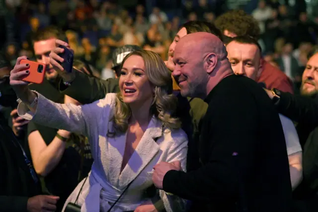 Dana White poses for a selfie with a UFC fan