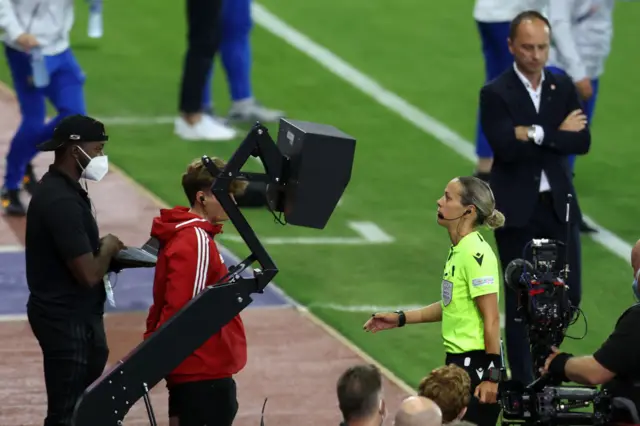 Referee Ivana Martincic checks the VAR screen for a penalty to France, which is later given during the UEFA Women's Euro 2022 Quarter Final match between France and Netherlands at The New York Stadium on July 23, 2022 in Rotherham, England.