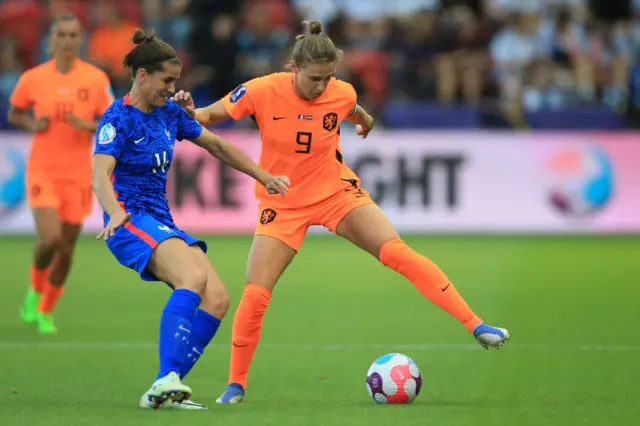 France's midfielder Charlotte Bilbault vies with Netherlands' striker Anna Miedema during the UEFA Women's Euro 2022 quarter final football match between France and Netherlands at the New York Stadium, in Rotherham, on July 23, 2022.