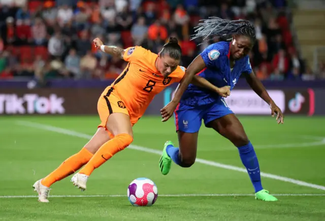 Kadidiatou Diani of France battles for possession with Sherida Spitse of The Netherlands during the UEFA Women's Euro 2022 Quarter Final match between France and Netherlands at The New York Stadium on July 23, 2022 in Rotherham, England.