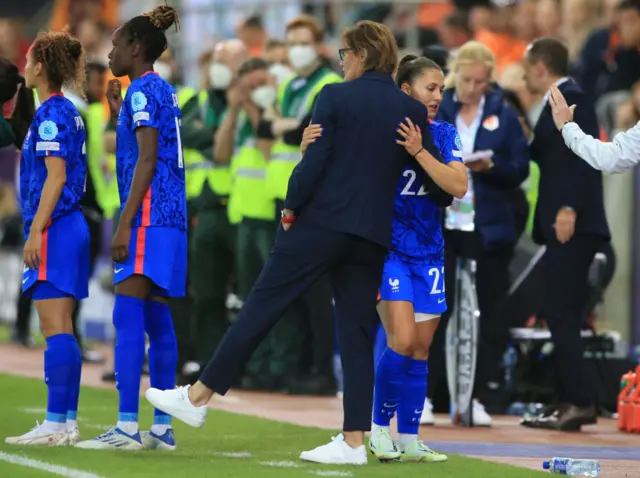 Eve Perisset celebrates her goal with France's head coach Corinne Diacre during the UEFA Women's Euro 2022 quarter final football match between France and Netherlands at the New York Stadium, in Rotherham, on July 23, 2022. - No use as moving pictures or quasi-video streaming. Photos must therefore be posted with an interval of at least 20 seconds