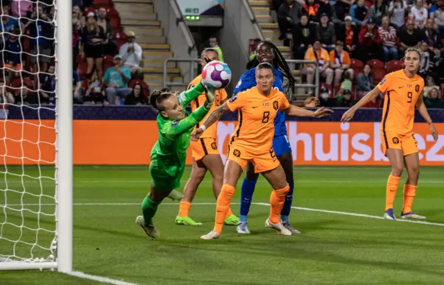 Daphne van Domselaar of Netherlands saves a header from Wendie Renard of France (not shown) during the UEFA Women's Euro England 2022 Quarter Final match between France and Netherlands at The New York Stadium on July 23, 2022 in Rotherham, United Kingdom