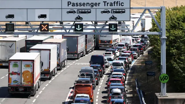 Vehicles queue to enter the Eurotunnel terminal in Folkestone