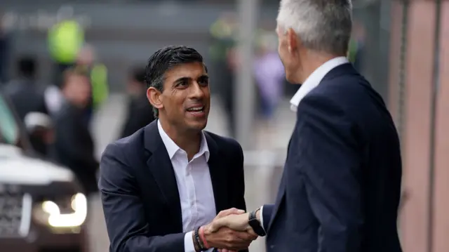 Rishi Sunak (left) is greeted by Director general of the BBC Tim Davie before taking part in the BBC Tory leadership debate live. Our Next Prime Minister, presented by Sophie Raworth, a head-to-head debate at Victoria Hall in Hanley, Stoke-on-Trent