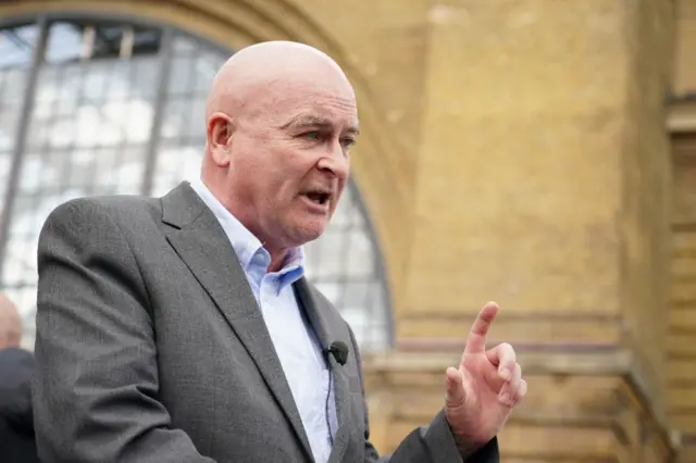 Mick Lynch speaks outside London's King's Cross station