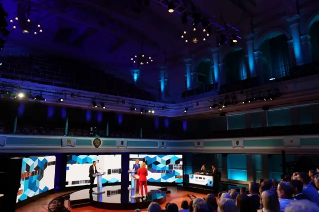 The candidates take part in the debate in Stoke