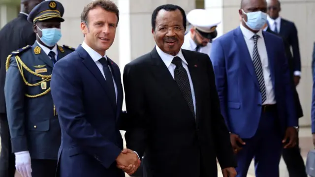 Cameroon's President Paul Biya shakes hands with his French counterpart Emmanuel Macron at the presidential palace in Yaoundé, Cameroon - 26 July 2022