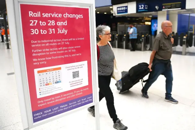 A sign at London's Waterloo station advises passengers of disruption on days following strikes