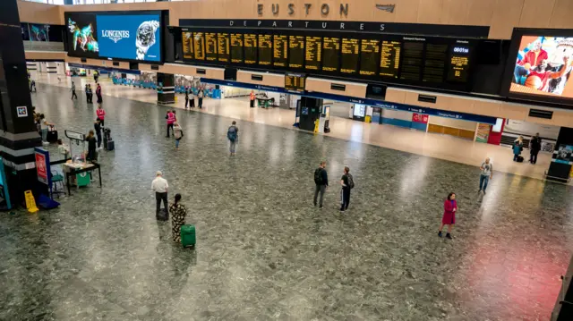 The near-empty station concourse during rush hour at London Euston train station