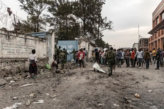 This image taken in Goma on July 26, 2022 shows Congolese soldiers intervening as demonstrators stage a protest outside a UN base of the UN peacekeeping mission in Democratic Republic of Congo, MONUSCO