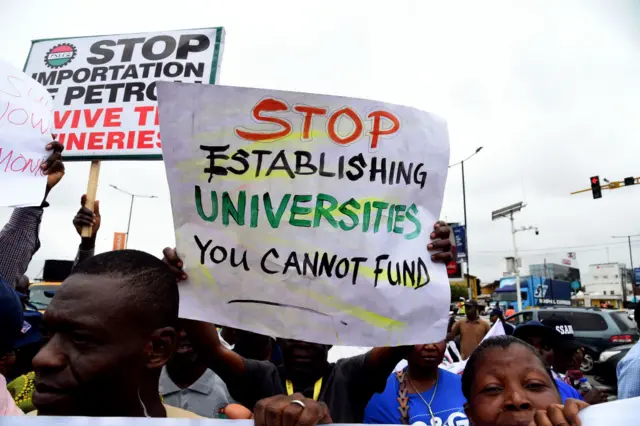 Banner which says: stop establishing universities you cannot fund