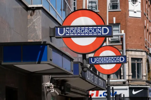 London Underground signs pictured at Aldgate East station