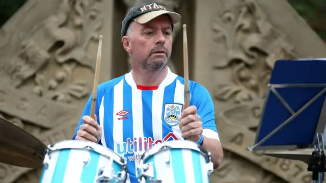 Huddersfield fan plays drums