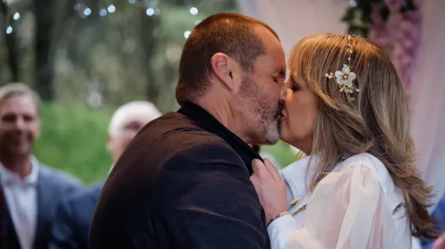 Toadie and Melanie kiss at their wedding