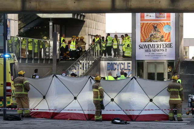 Emergency personnel, including armed police, stationed outside Field's shopping centre