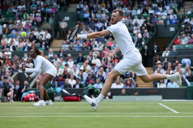 Jamie Murray in action alongside Venus Williams