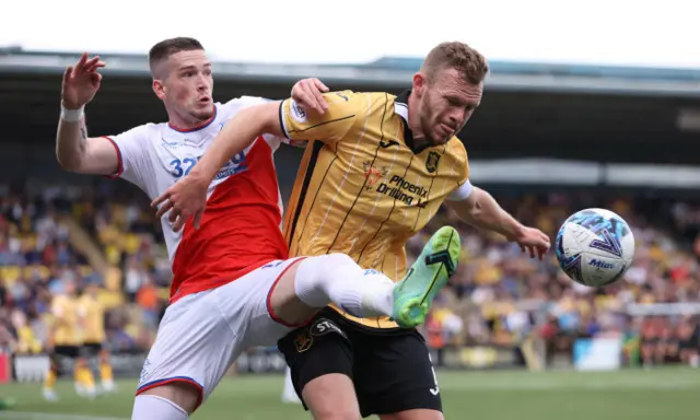 Rangers Ryan Kent challenges Livingston's Nicky Devlin