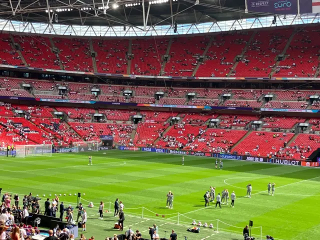 England players walk around Wembley pitch