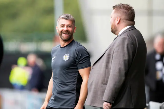 St Mirren boss Stephen Robinson is all smiles as he chats to Motherwell CEO Alan Burrows this afternoon