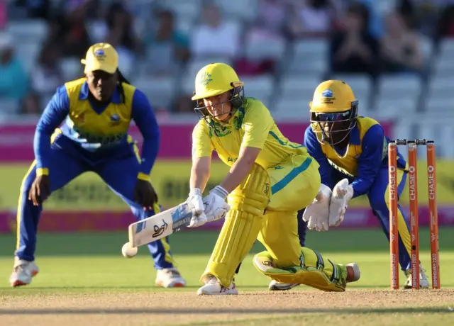 Australia's Alyssa Healy hits a shot against Barbados in the 2022 Commonwealth Games