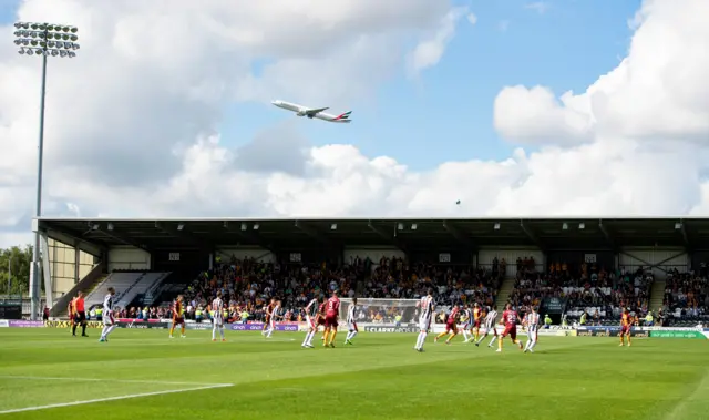 A aeroplane rises above St Mirren Park