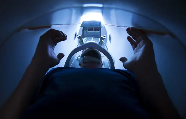 An athletes undergoes an MRI scan.