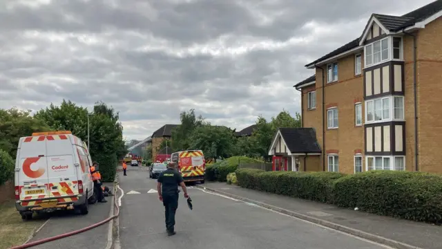 A cordon that has been set up to keep people away while firefighters tackle the blaze in Redwood Grove, Bedford