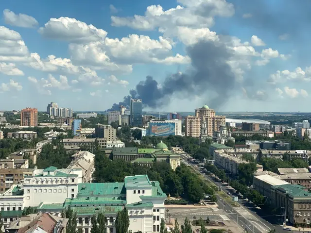 Smoke rising from a city after shelling in Donetsk