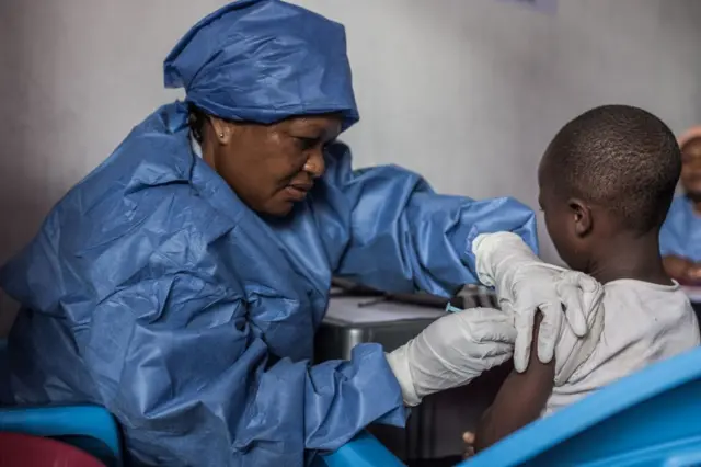 A girl receives the Ebola vaccine during a previous outbreak in the country in 2019.