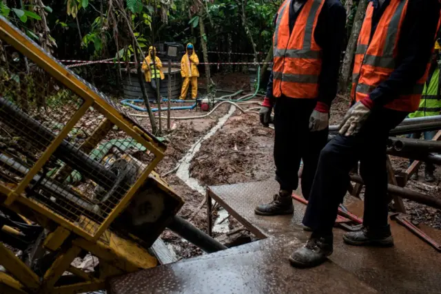 A mineral exploration drilling team drills holes to identify the location and the quality of gold deposits in Nigeria