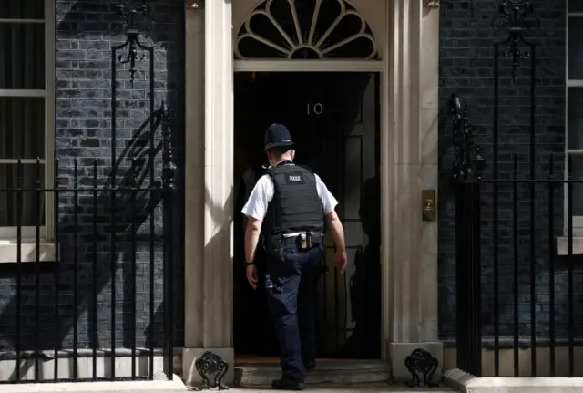 Police officer enters No 10