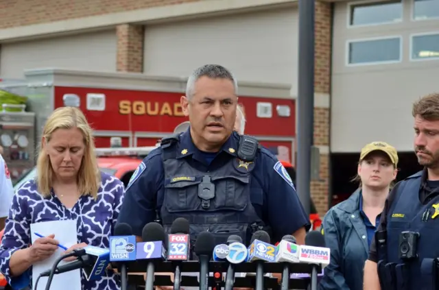 Commander Chris O'Neill of the Highland Park Police speaks to the media