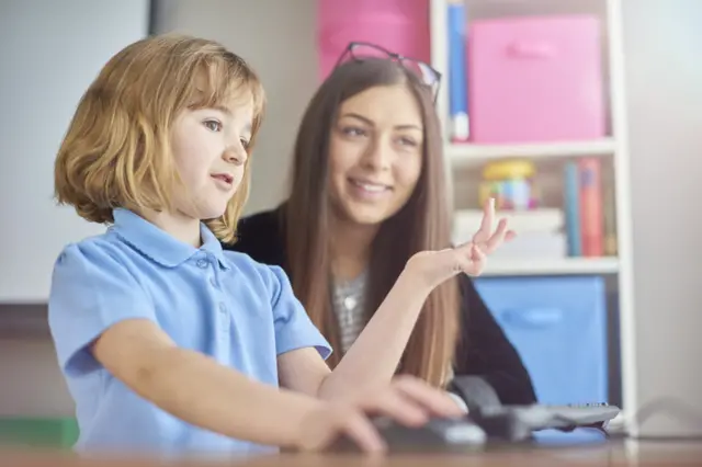 Stock image of teacher and child