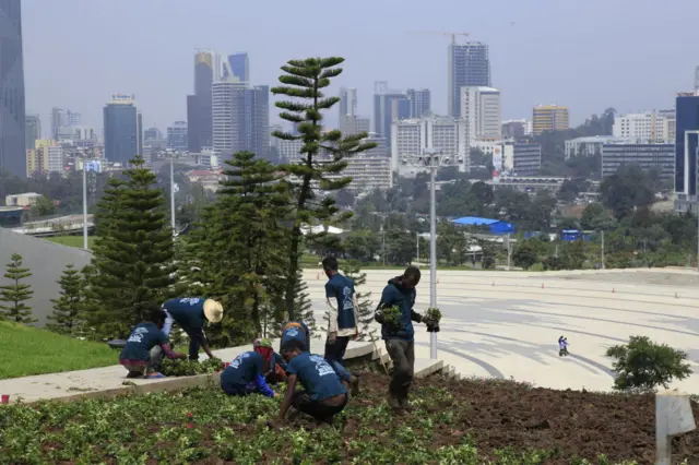 Workers clean the Friendship Park in Addis Ababa, Ethiopia