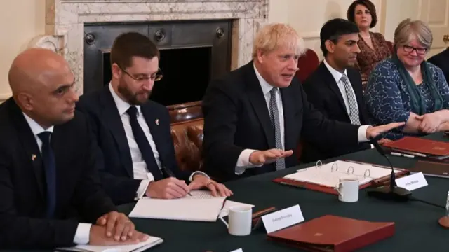 Britain's Health Secretary Sajid Javid (L), Simon Case (2L), Britain's Prime Minister Boris Johnson (C) Britain's Chancellor of the Exchequer Rishi Sunak (3R) and Britain's Work and Pensions Secretary Therese Coffey (R) attend the start of a cabinet meeting in Downing Street in London on July 5, 2022.