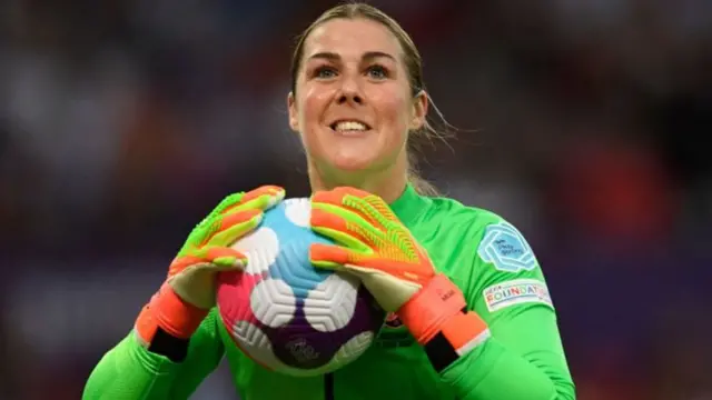 A photo of England goalkeeper Mary Earps holding a football