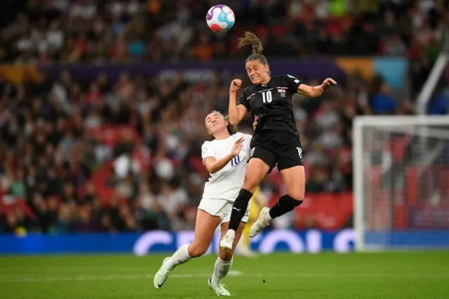 A photo of England and Austria players competing