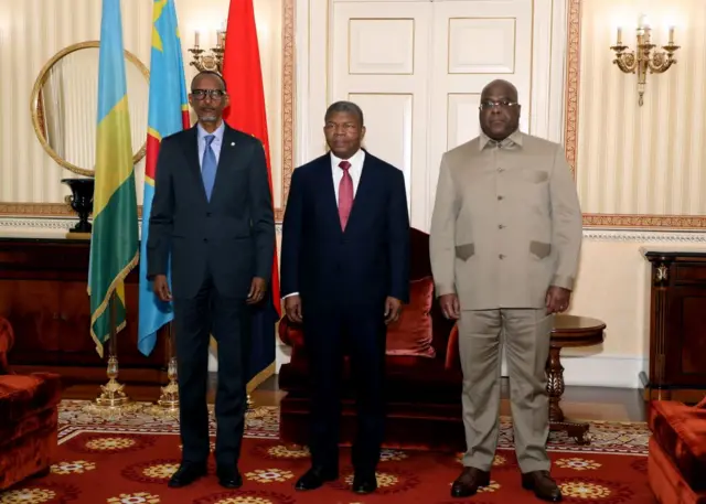 Rwanda President Paul Kagame (L), Angola President Joao Lourenco (C) and Democratic Republic of Congo President Felix Tshisekedi (R) pose for a photograph in Luanda on July 6, 2022