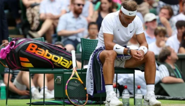 Rafael Nadal looks down