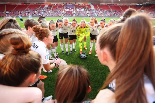 A photo of Northern Ireland players in a pre-match huddle