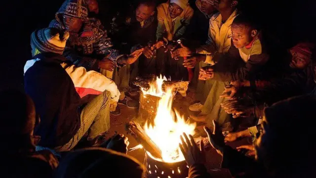 South Africans light fires to keep warm
